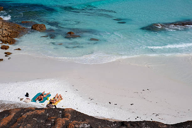 istock Two women relaxing at Thistle Cove, Western Australia 2211068959
