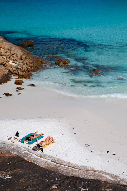 Two women relaxing at Thistle Cove, Western Australia