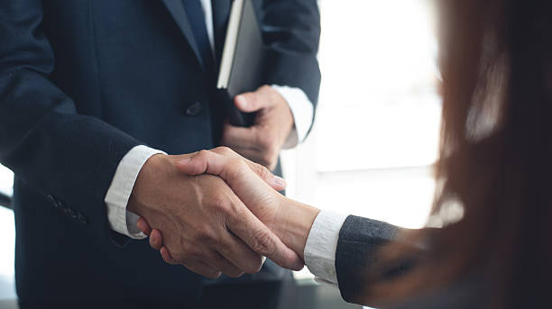 istock Businessmen making handshake with partner at office, greeting, dealing, merger and acquisition, successful deal concept, for business, finance and investment background, teamwork, partnership, hand shaking 2211071573