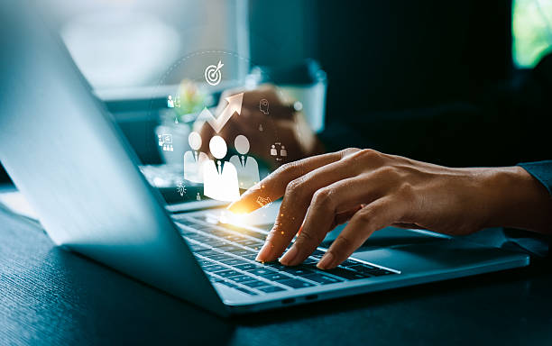 istock Digital Training and Development Concept, Business Professional Typing on Laptop with Icons Representing Workforce Growth, Strategic Goals, and Leadership Innovative Training 2211072573