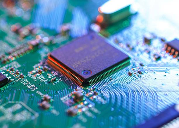 istock Intricate details of a computer circuit board, showcasing a processor in a close-up view. 2211075876
