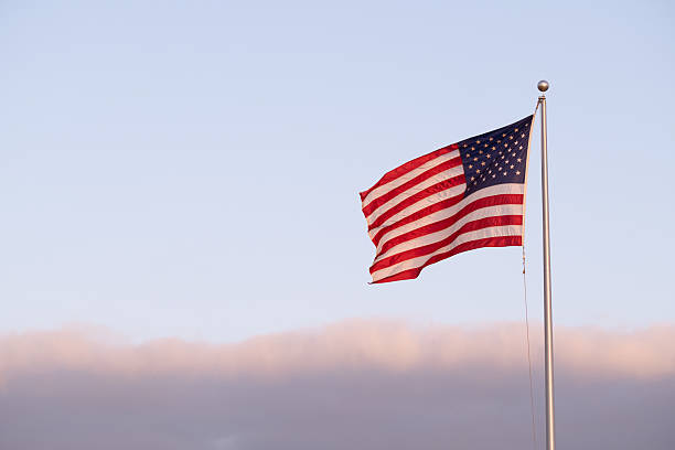 istock American Flag at Dusk 2211078468