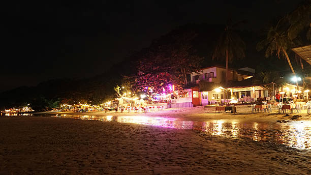istock Beach restaurant serving dinner at night in tropical paradise 2211078630
