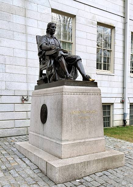 Statue of John Harvard, by Daniel Chester French at Harvard University, Cambridge, MA, USA stock photo