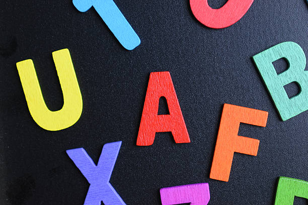 istock colorful letter alphabet on black background, object for education 2211080068