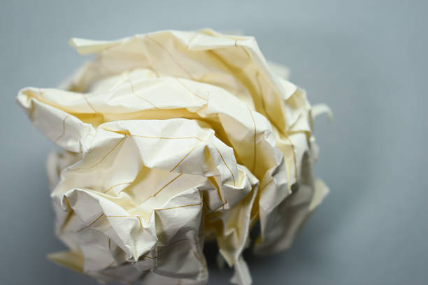 round lump paper on grey background, recycle used paper