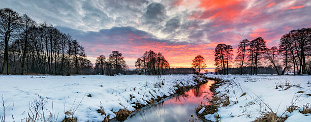 istock Beautiful winter sunset over the river banks 2211080755