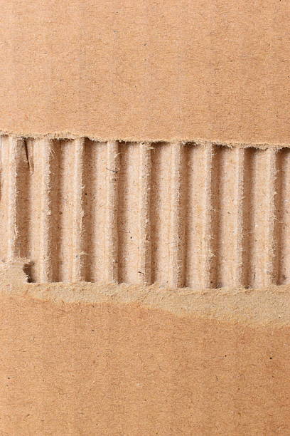 istock tear brown cardboard box texture background, recycle material 2211080757
