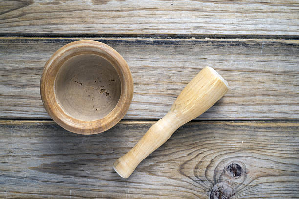 istock wooden mortar and pestle 2211083239