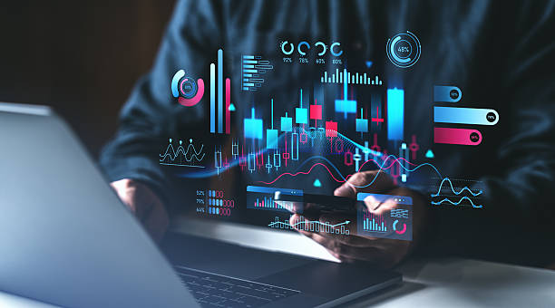 istock Businessman analyzing financial data on smartphone and laptop. 2211083761