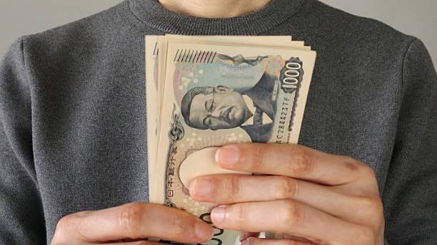 istock Person holding Japan's new 1000 yen note 2211084145