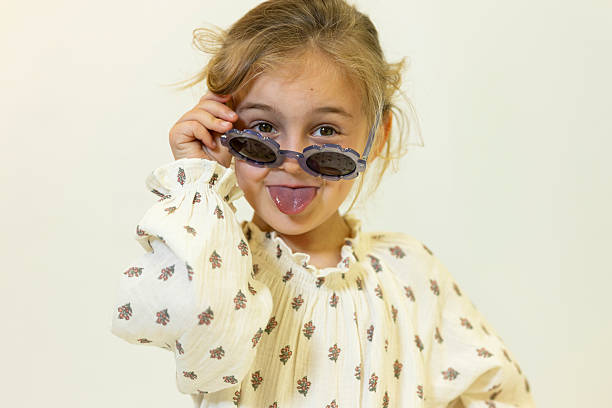istock Happy caucasian children posing and playing in commercial studio with copy space 2211088589