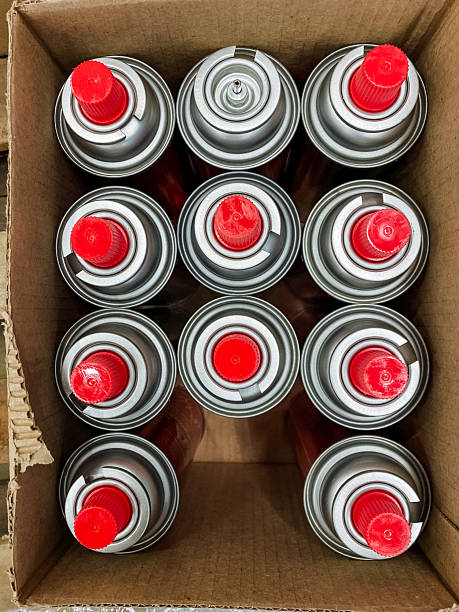 istock A box containing multiple spray paint cans, each distinguished by their bright red caps, suitable for various art and DIY projects, perfect for adding color to different surfaces 2211090283