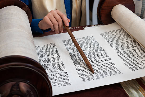 istock Closeup of a yad or pointer to guide the Torah reader through the Hebrew text. 2211093651