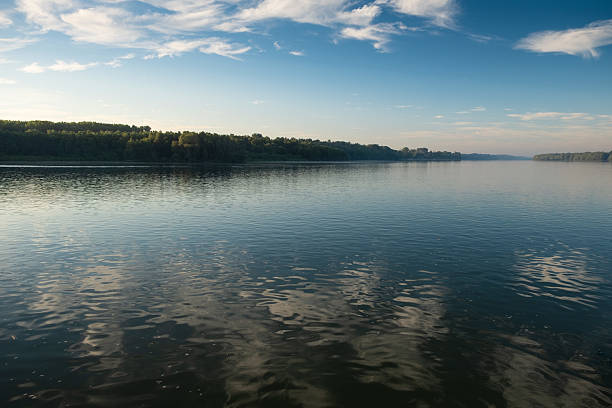 A bend in the Danube River in Hungary seen from a ship at dawn
