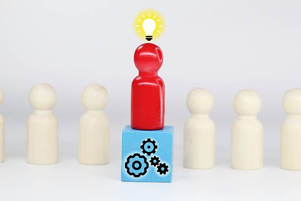 istock peg dolls, colored cubes with Idea and teamwork icons 2211097078