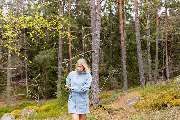 istock Woman enjoying spring walk in forest 2211097393