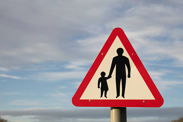 istock Pedestrians in road ahead sign, 2211098064