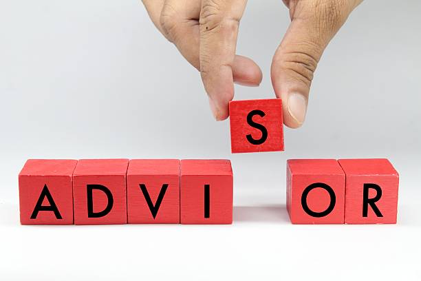 istock colored cubes with the letter advisor word text and a hand holding the letter S 2211098927