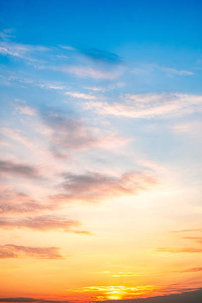 istock Sky,sunset, beautiful , luxury soft gradient orange gold clouds and sunlight on the blue sky perfect for the background, Sunrise on morning or everning in winter warm time ,Twilight summer,silhouette 2211099658