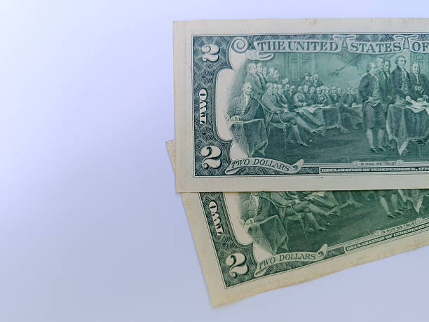 istock Two US 2 dollar banknotes. Two dollars. US banknotes. Business concept. 2211100451