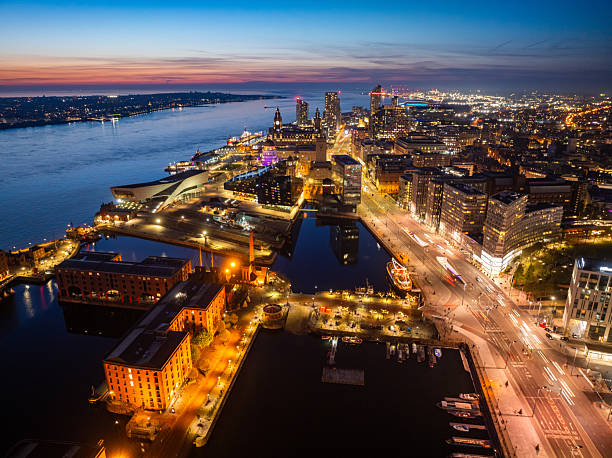 istock Liverpool cityscape illuminating the night at dusk 2211102713