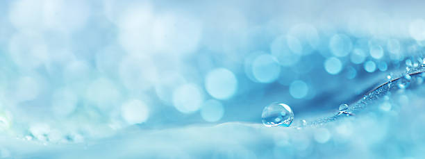 istock round water droplets on a blue background with beautiful defocused bokeh 2211105123