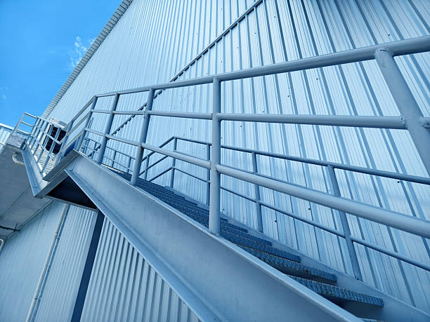 istock A set of stairs ascending a large blue wall 2211105381