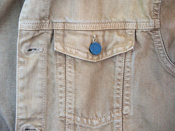 istock Close-up of a denim fabric pocket and button 2211107326
