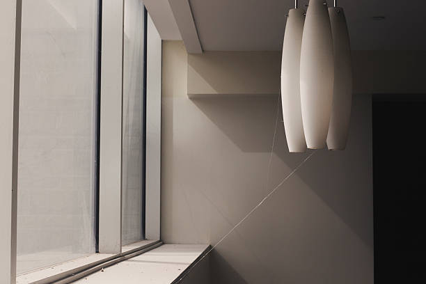 Sleeping Giant Observation Tower interior at the summit of Mount Carmel in Hamden, Connecticut, United States, featuring abstract geometry formed by windows, shadows, and sunrays.
