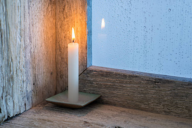 istock candle on the sill of a window 2211112046