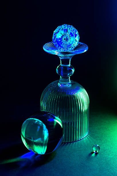 Decorative glass designs in vibrant colorful lighting. Geometric patterns and artistic illumination elegance.