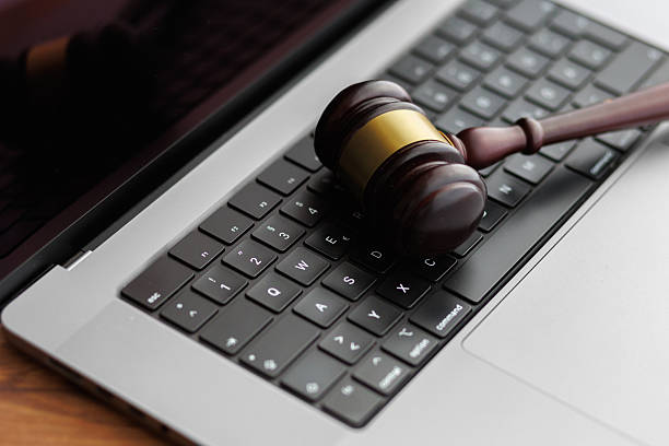 istock Judge gavel of justice on laptop computer keyboard 2211121078