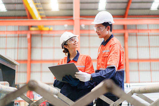 istock Team of engineers are perform the inspection on a machines. 2211122793