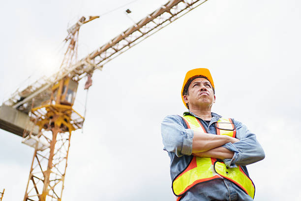 istock Asian contractor portrait in construction site. 2211123049