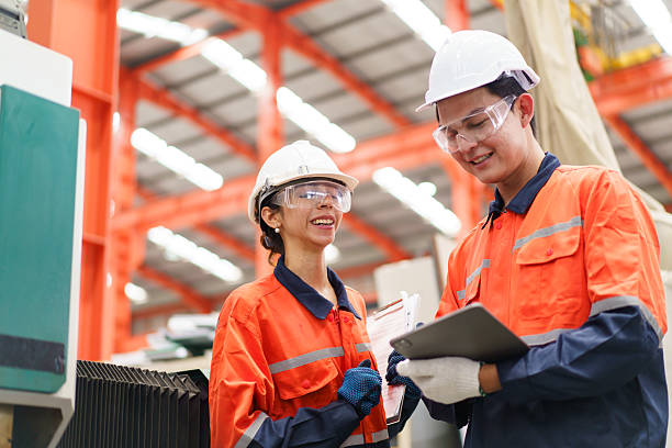 istock Team of engineers are working in factory. 2211123187