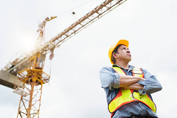 istock Asian contractor portrait in construction site. 2211123198