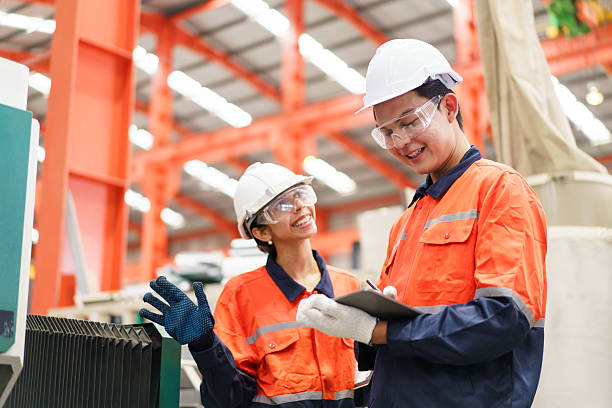 istock Team of engineers are working in factory. 2211123251