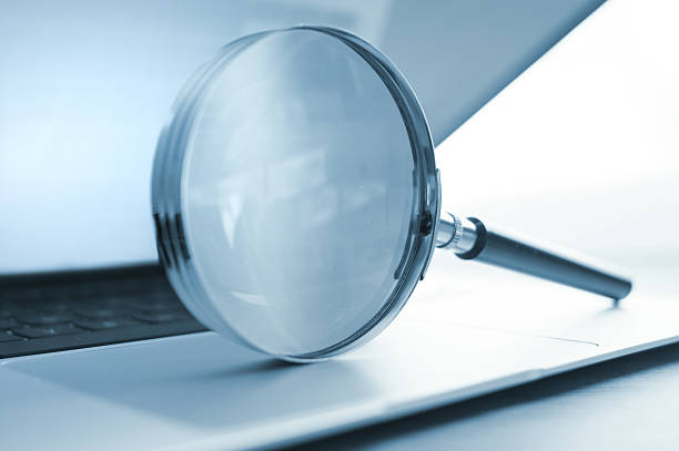 istock Magnifying Glass on Laptop 2211125972