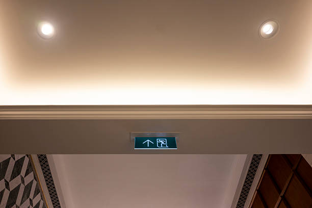istock Emergency escape direction sign on the corridor wall 2211130397