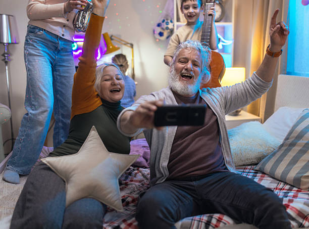 istock Grandparents having fun with their grandchildren while playing musical instruments 2211134844