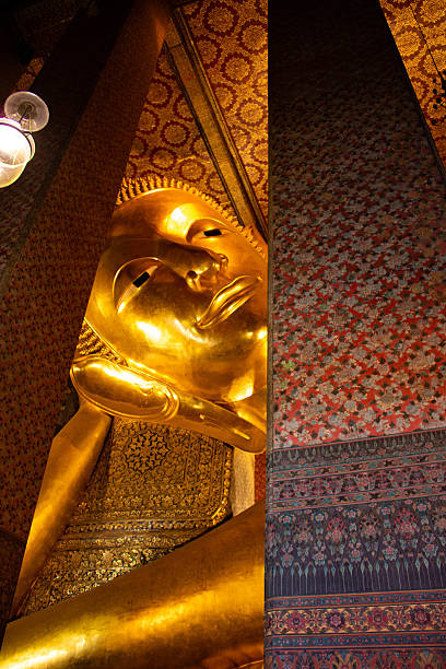 istock The head of Buddha seen through columns. 2211135040