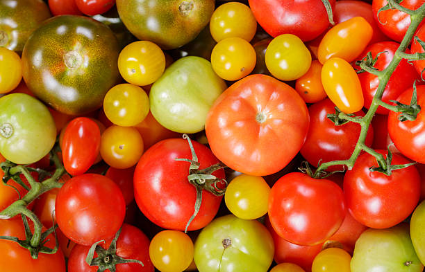 istock mix of fresh tomatoes as background, top view 2211135098