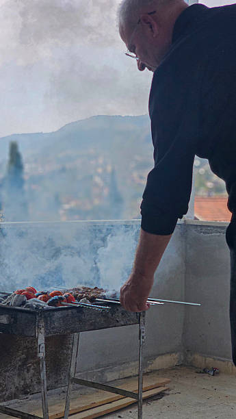 istock Man cookingAdana kebab on the grill 2211138188