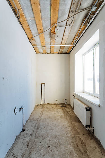 istock The room is empty with only a radiator for warmth and a window for natural light, featuring a bare floor that creates a clean, spacious atmosphere for work, relaxation, or creativity 2211143103