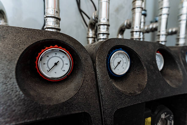 istock This image shows a closeup of two expertly mounted pressure gauges on a machine, highlighting their intricate design and functionality in accurately measuring pressure levels 2211143115