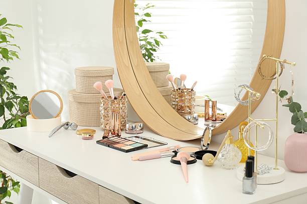 istock Makeup room. Dressing table with mirror, different beauty products and jewelry indoors 2211143520