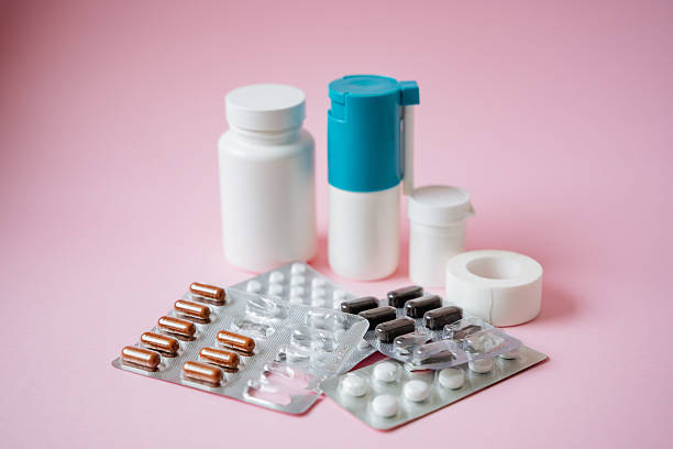 istock A variety of assorted medicinal pills and dietary supplements arranged artfully on a light pink background, showcasing their diverse shapes and beneficial purposes 2211144256