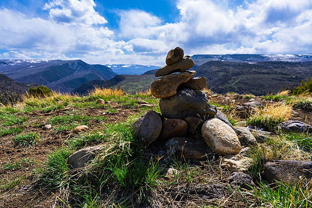 istock Rock Cairn Trail Marker at Top of Mountain Pass 2211144923