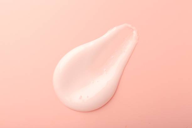 istock Cream sample on pink background, top view 2211147175
